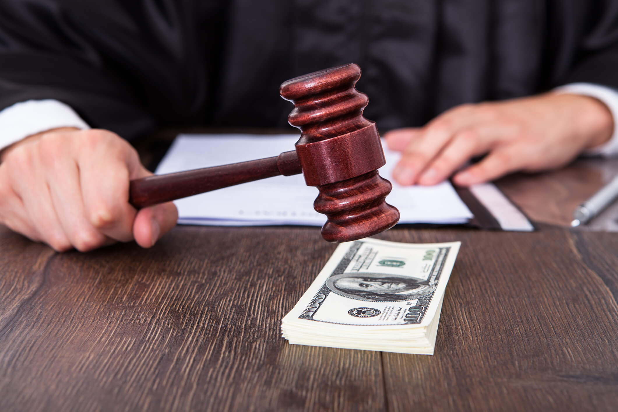 Handshake Over Legal Documents