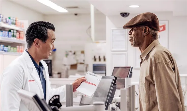 An image of a community pharmacy connecting with patients, representing enhanced patient engagement