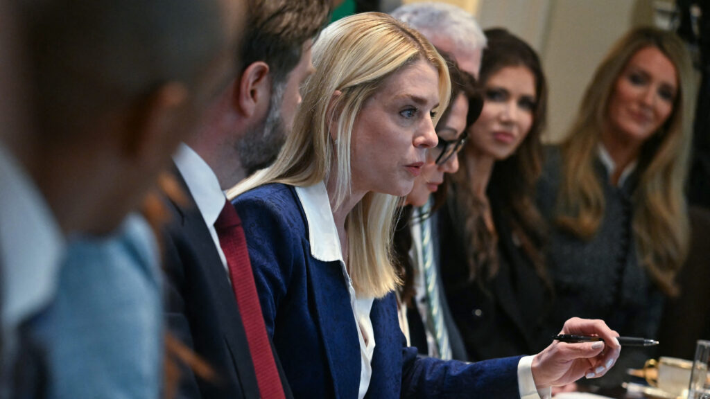 Symbolic image of a gavel and medical syringe balancing on scales of justice