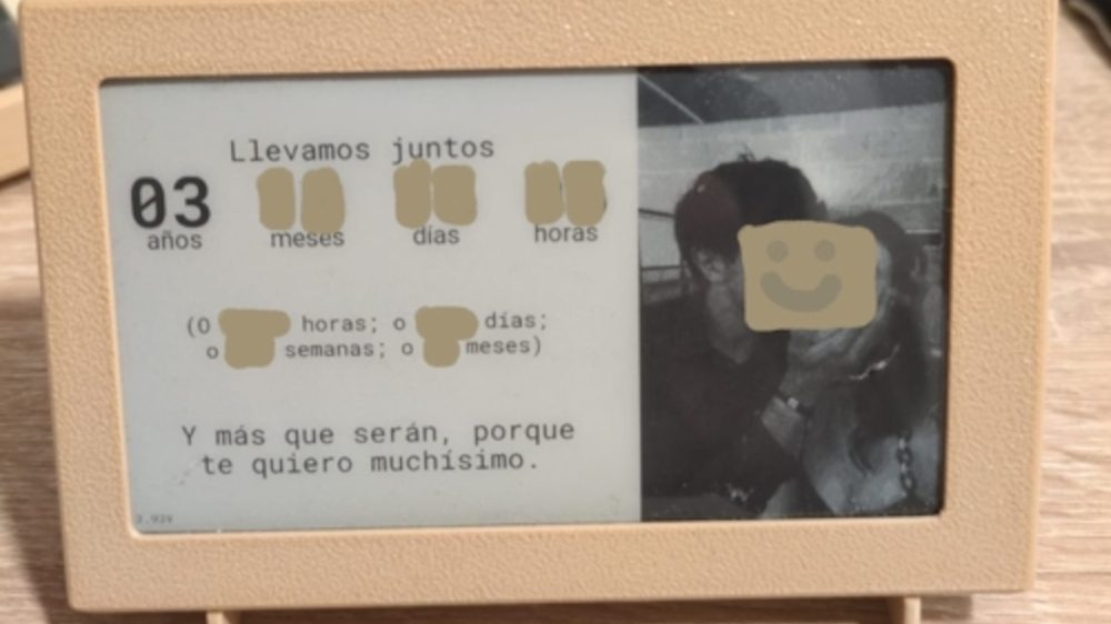 A minimalist e-paper display showing time and positive messages