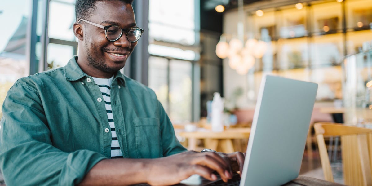 A person standing at a crossroads under a sunrise, symbolizing life choices and new beginnings