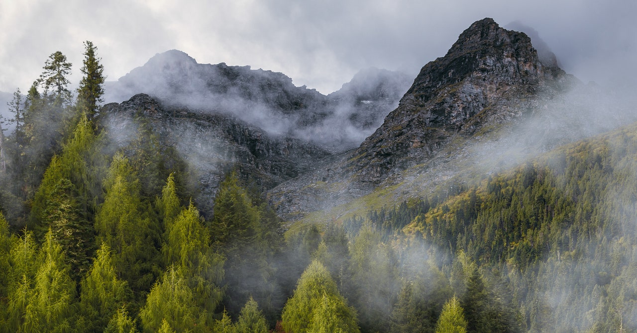 A serene landscape with traditional Chinese countryside elements and a rustic kitchen