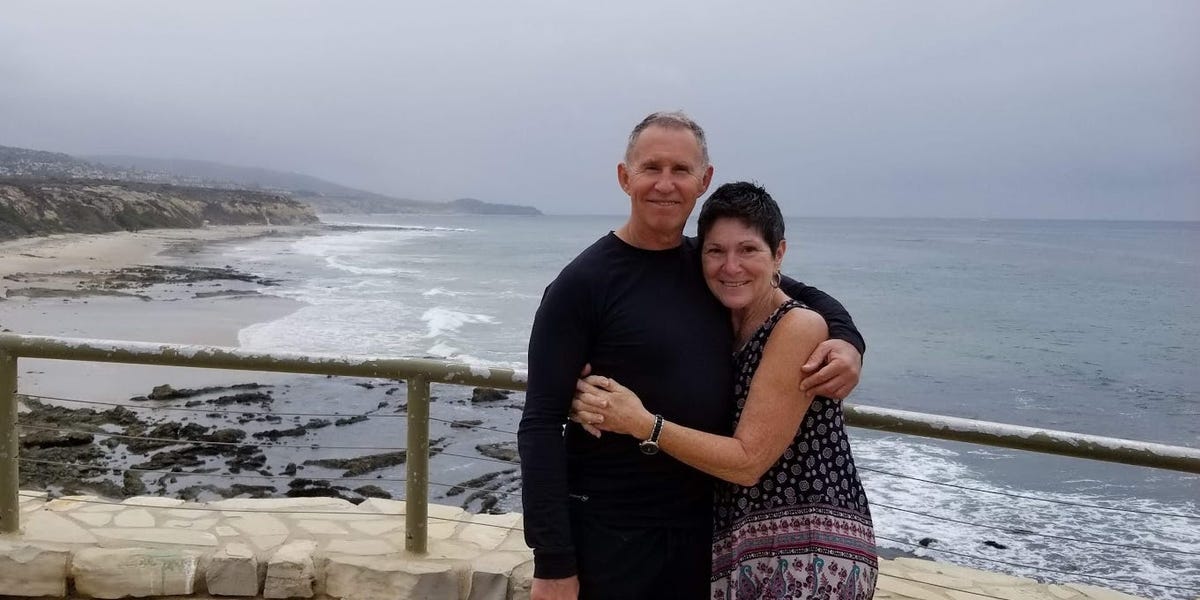 An adventurous couple exploring a vibrant cityscape abroad