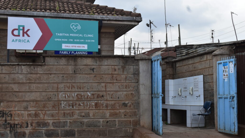 An illustration of a clinic in a Kenyan community, symbolizing healthcare challenges