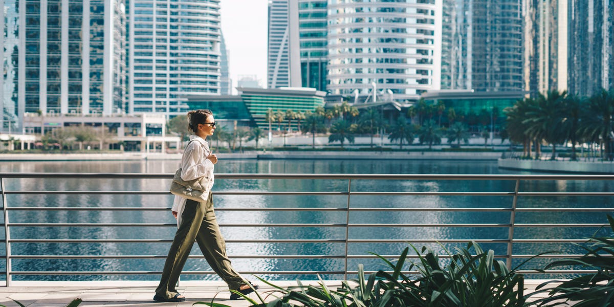 An individual balancing work and leisure under the Dubai skyline