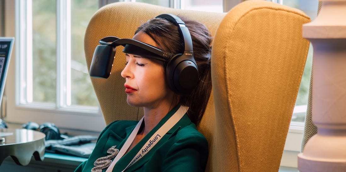 A futuristic conference hall nestled in the Swiss Alps, buzzing with discussions on longevity and anti-aging