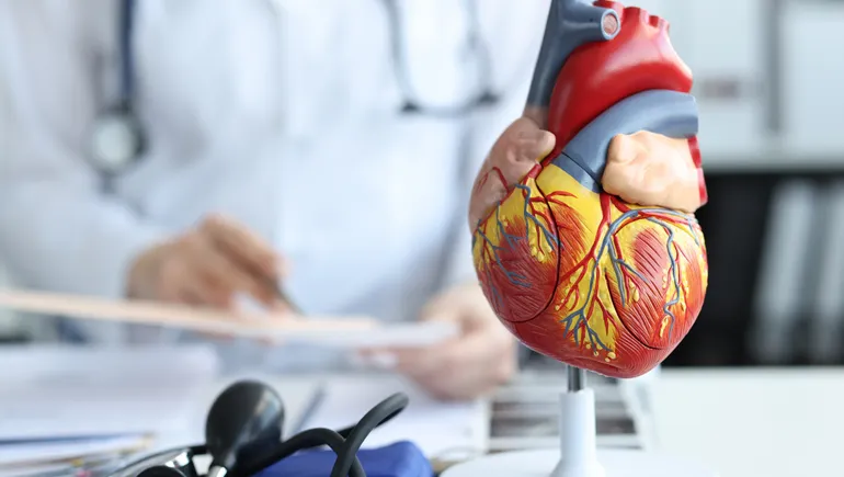 A futuristic image of a human heart superimposed with DNA strands and molecular structures