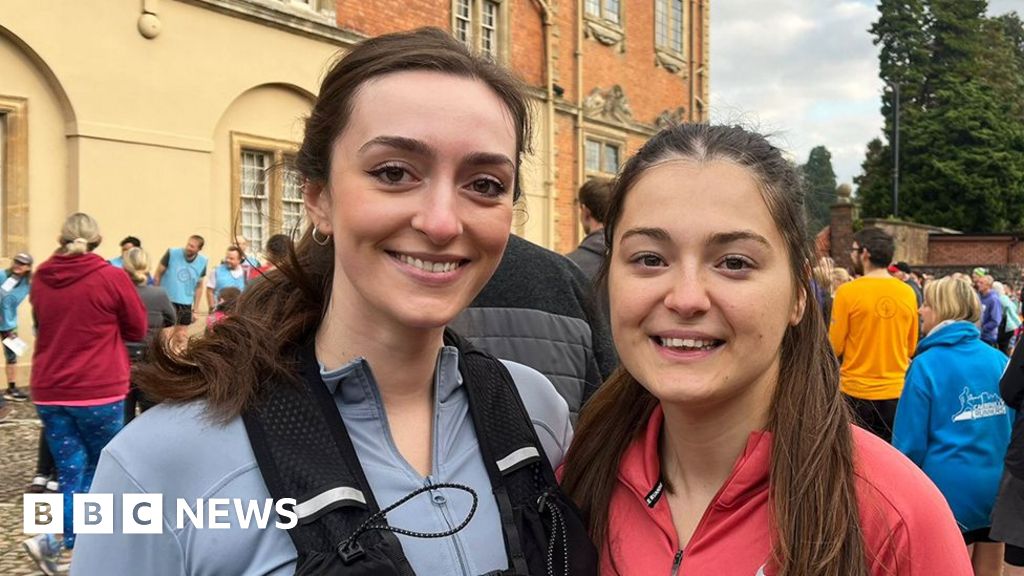 A group of joyful runners sharing a sunrise jog along a scenic path