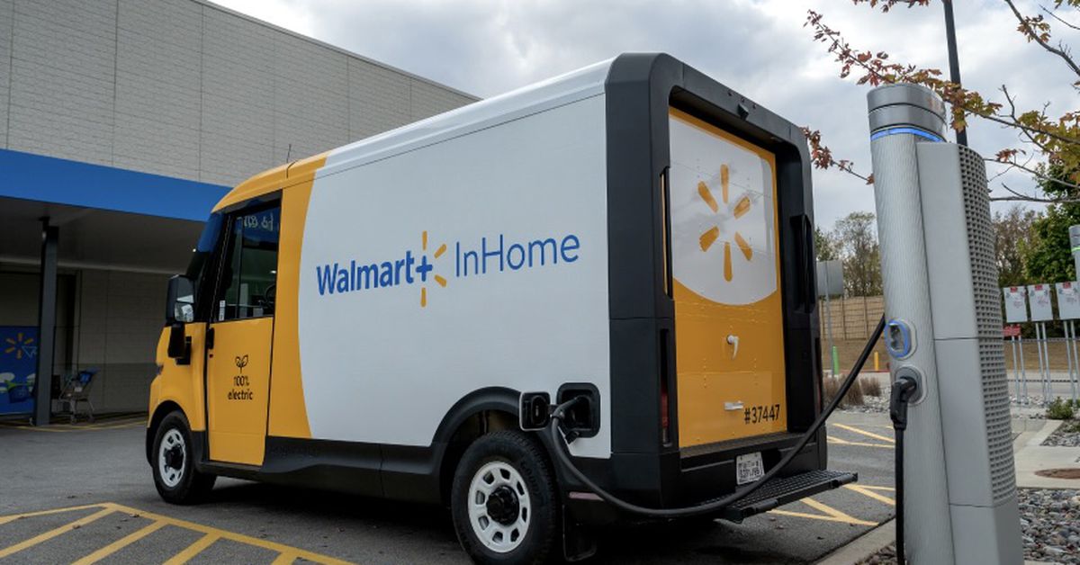 Electric van delivering goods in a cityscape with Walmart logo